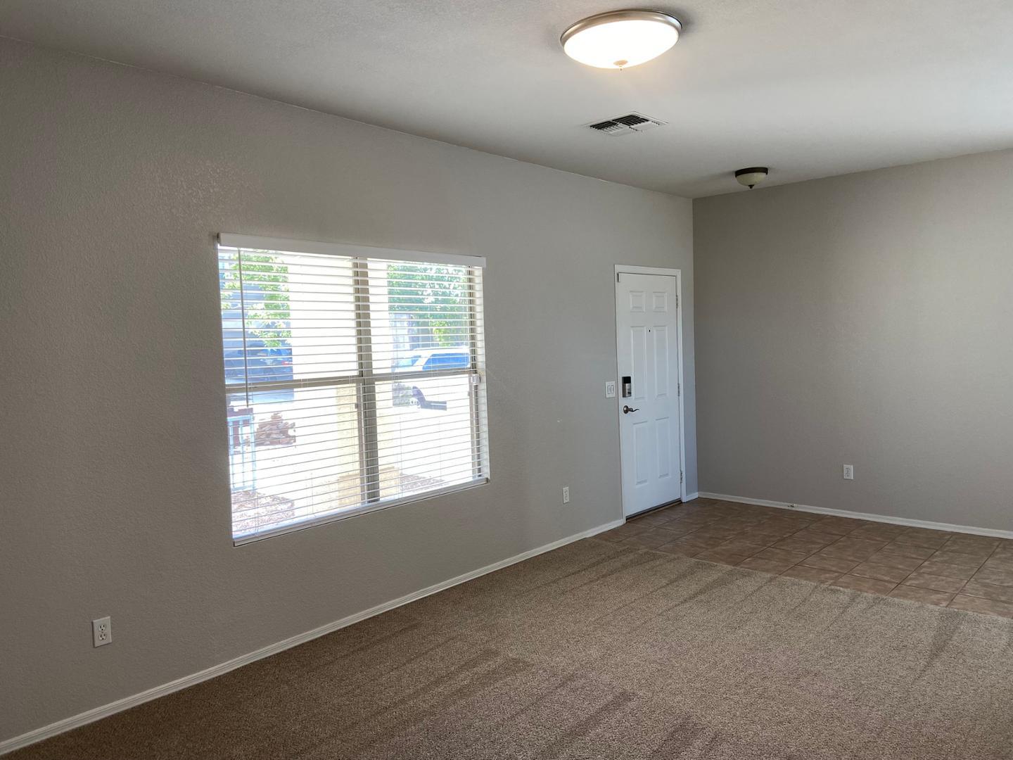 1330 East Pedro Road Phoenix, AZ 85042 - Photo 22 of 50 an empty room with a window