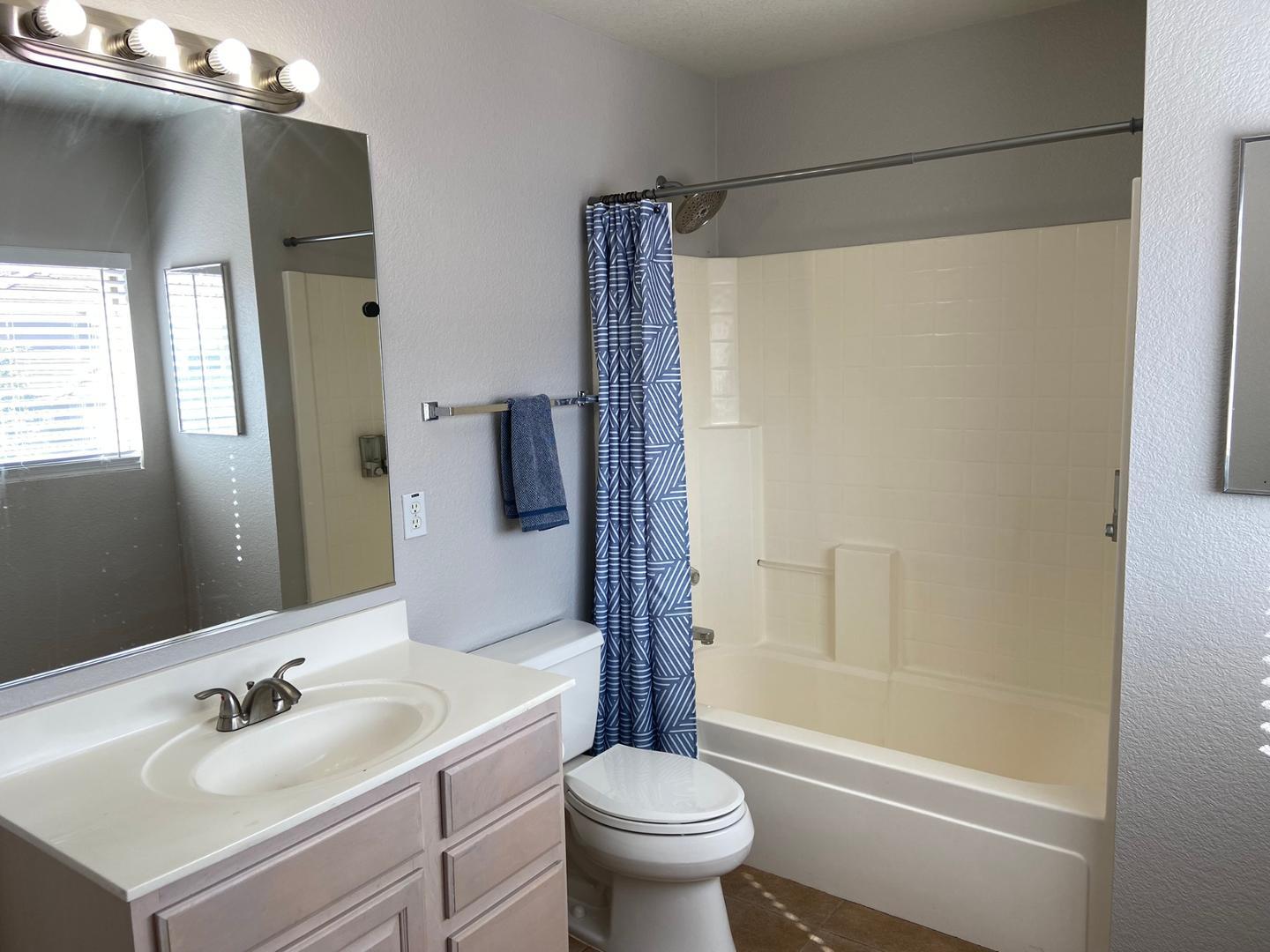 1330 East Pedro Road Phoenix, AZ 85042 - Photo 31 of 50 a bathroom with a sink toilet and shower