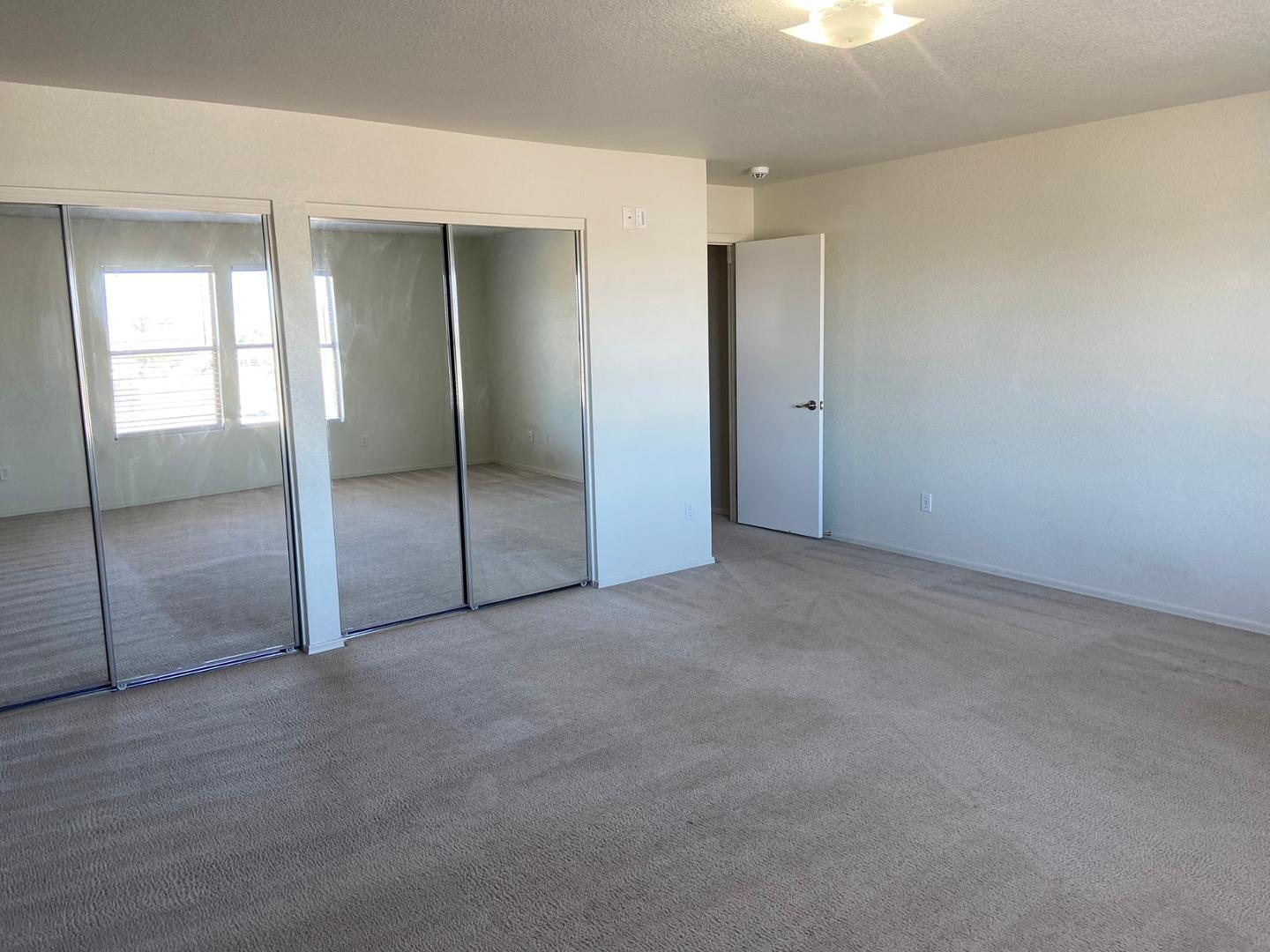 1330 East Pedro Road Phoenix, AZ 85042 - Photo 38 of 50 an empty room with sliding glass door and shower