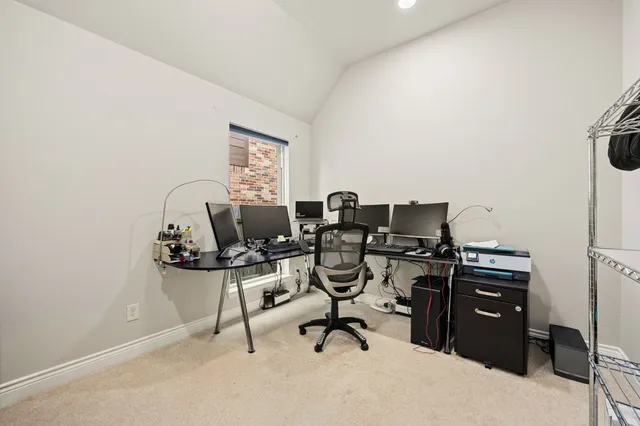 a view of a workspace with furniture