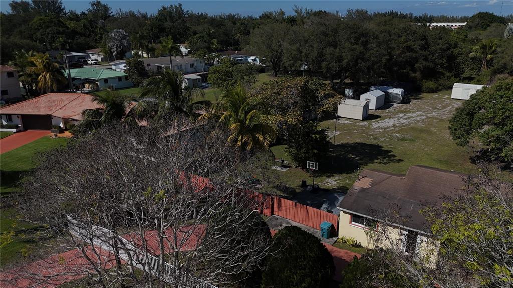 940 Northwest 151st Street Miami, FL 33169 - Photo 11 of 13 a view of a house with a yard