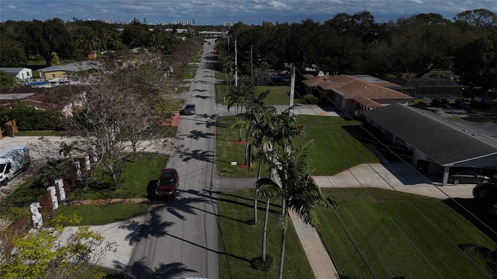 940 Northwest 151st Street Miami, FL 33169 - Photo 12 of 13 a view of multiple houses with outdoor space