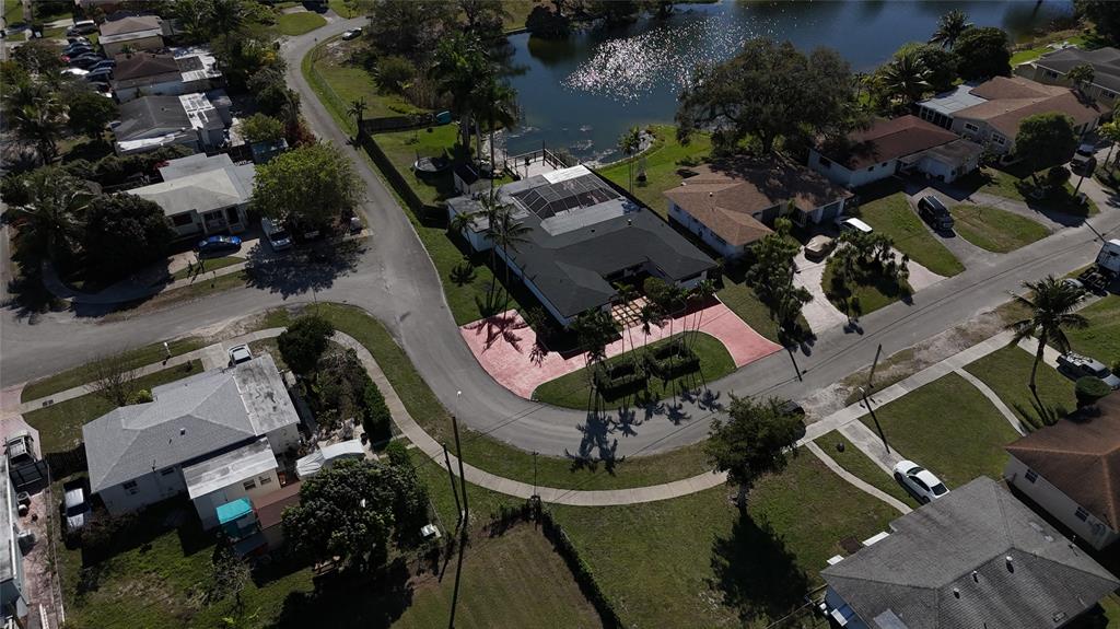940 Northwest 151st Street Miami, FL 33169 - Photo 2 of 13 an aerial view of multiple houses with yard