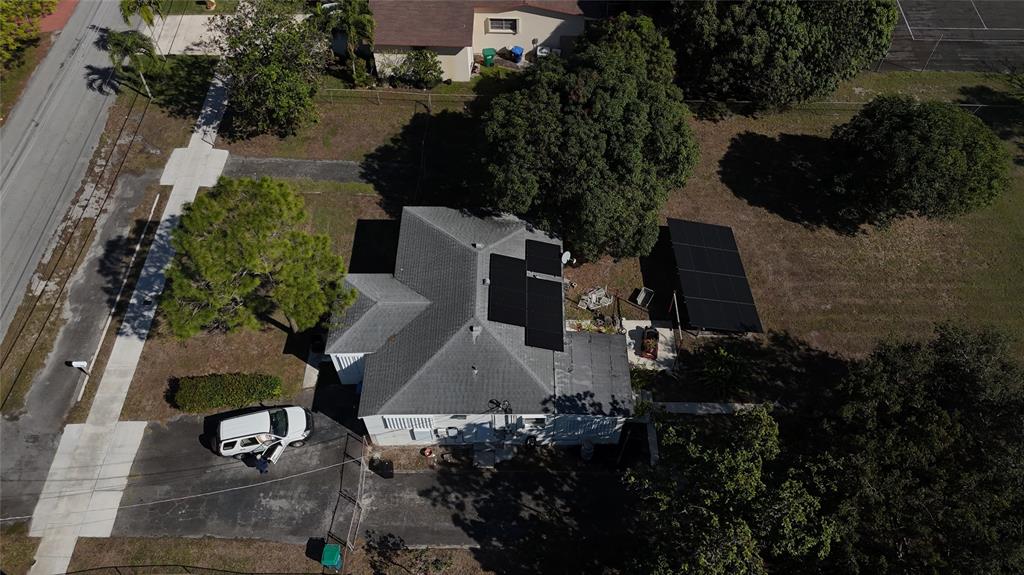 940 Northwest 151st Street Miami, FL 33169 - Photo 6 of 13 an aerial view of a house with a yard