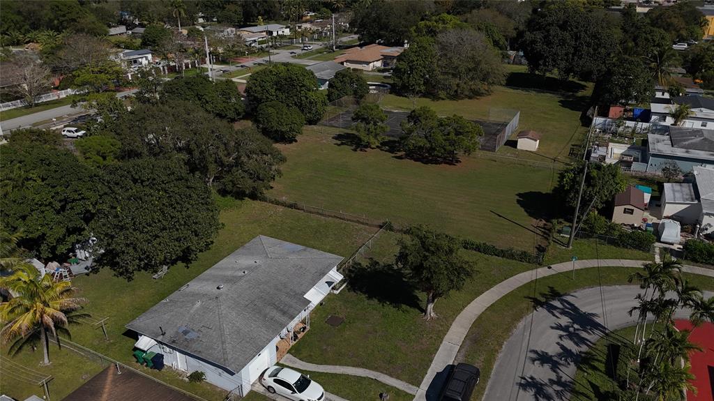940 Northwest 151st Street Miami, FL 33169 - Photo 9 of 13 an aerial view of a house with outdoor space and lake view