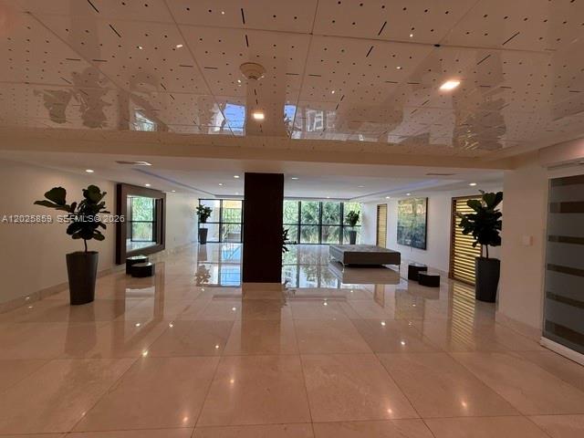 540 Brickell Key Drive, Unit 1024 Miami, FL 33131 - Photo 3 of 28 a view of a lobby with furniture and floor to ceiling window