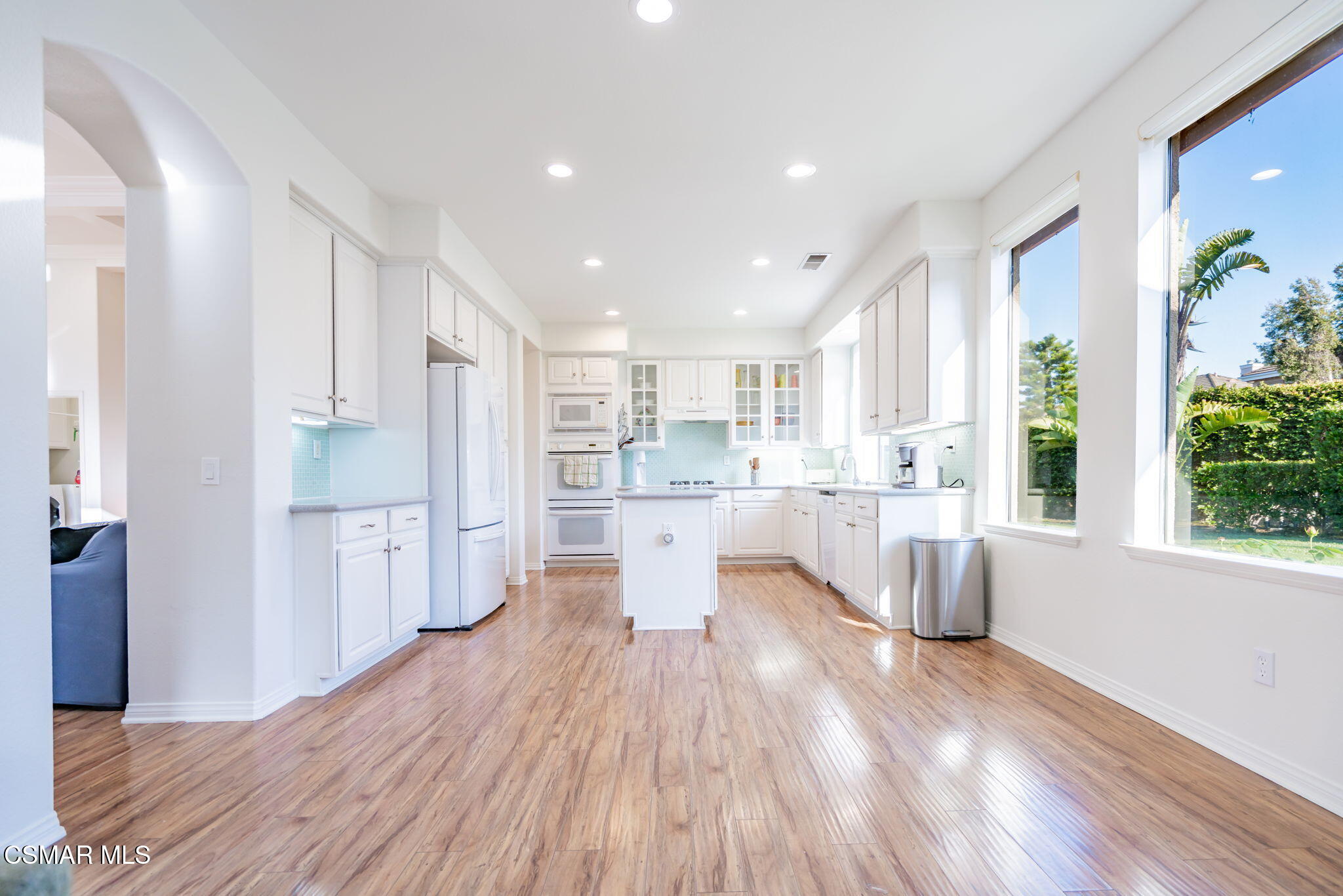 791 Eisenhower Way Simi Valley, CA 93065 - Photo 16 of 59 a large kitchen with a wooden floor and windows