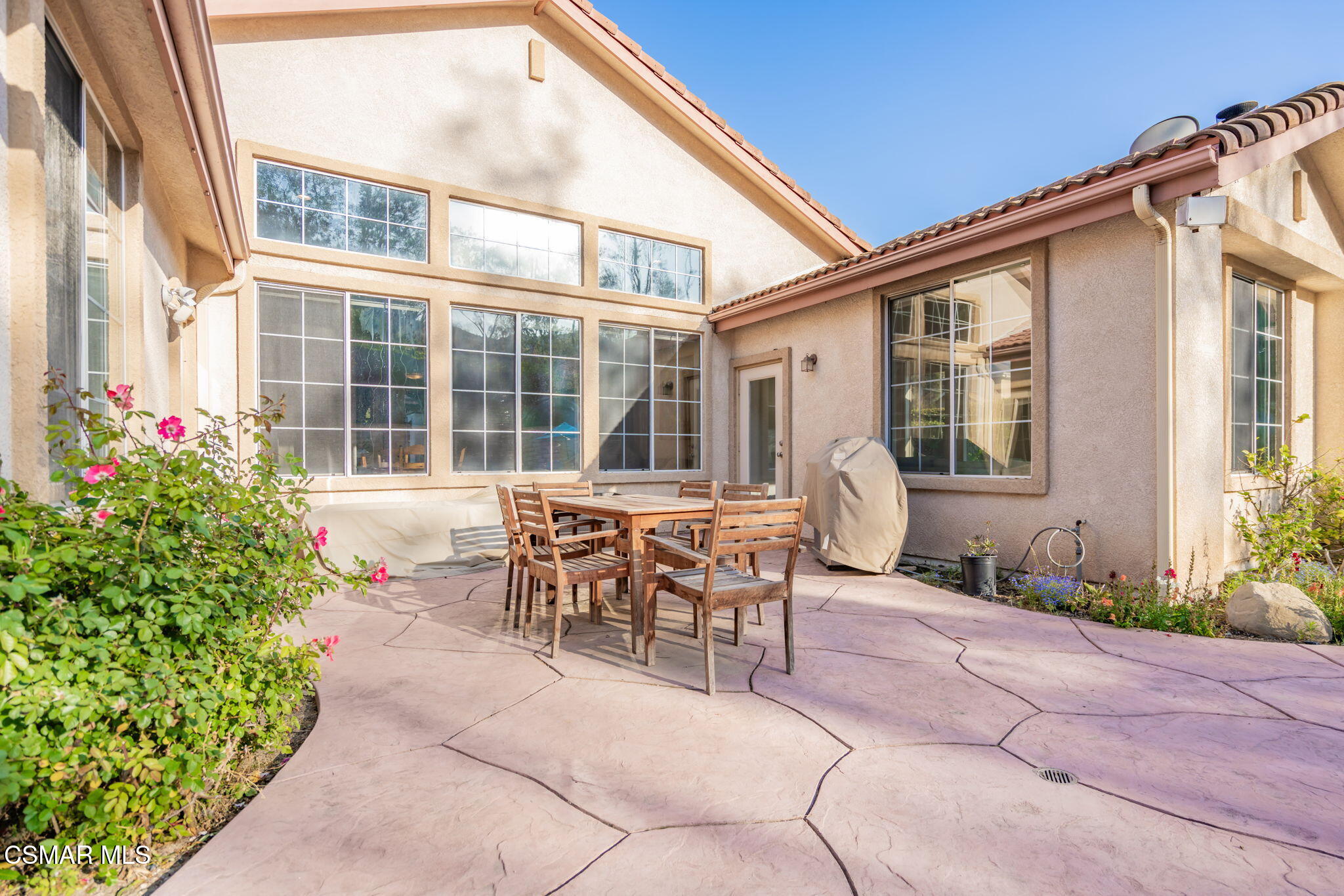 791 Eisenhower Way Simi Valley, CA 93065 - Photo 45 of 59 a patio with table and chairs and potted plants