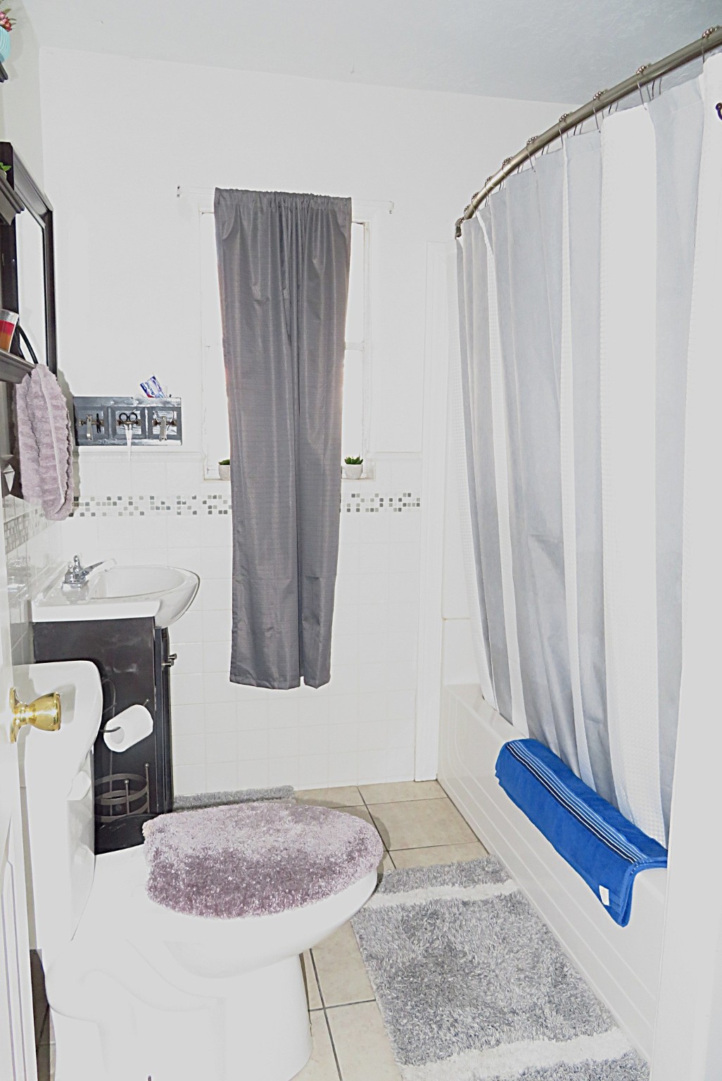 828 Robinson Road La Porte, TX 77571 - Photo 6 of 10 a bathroom with a granite countertop sink and a mirror