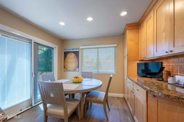a view of a livingroom with workspace and a window