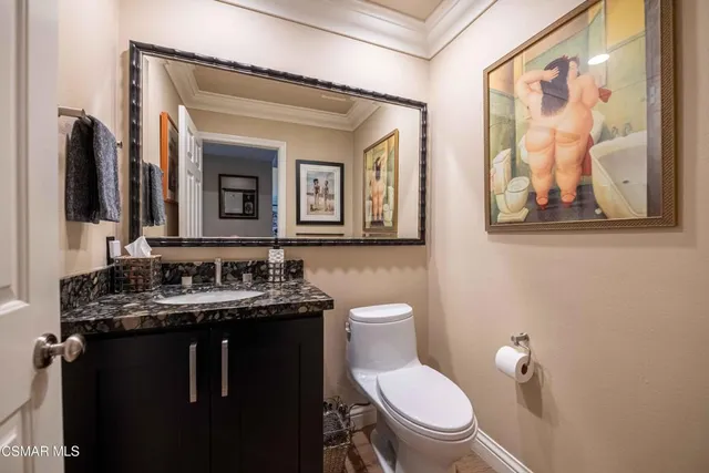 a view of a hallway with wooden floor and stairs
