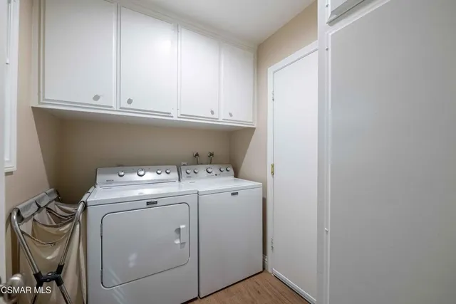 an aerial view of a house with a yard and outdoor seating