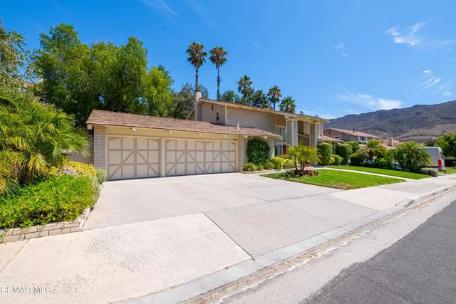 a living room with furniture and stairs