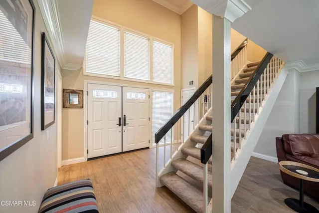 a view of a dining room with furniture and a window