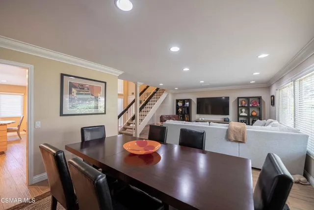 a kitchen with stainless steel appliances granite countertop a refrigerator stove and sink