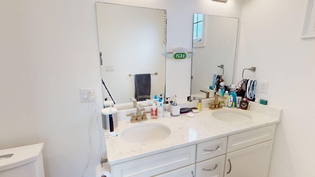 4 Market Street Cambridge, MA 02139 - Photo 12 of 22 a bathroom with a sink and a mirror