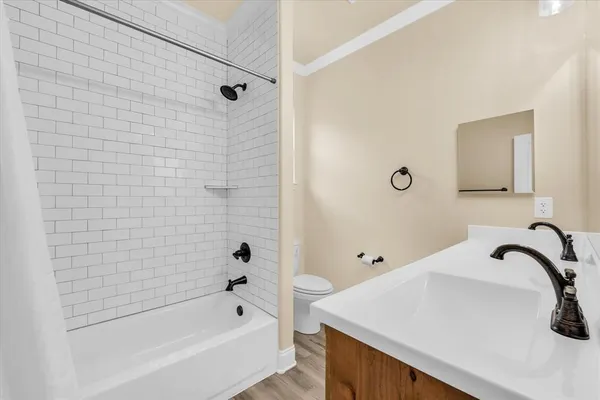 a bathroom with a sink a bathtub and a shower