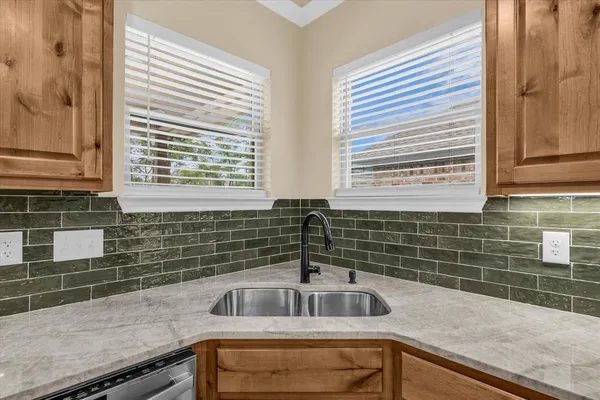 a kitchen with a sink and a window