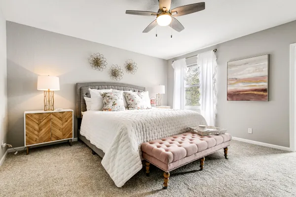 a bedroom with a bed and couch