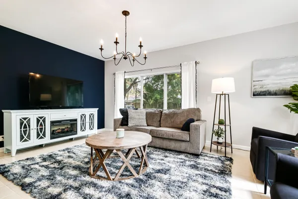 a living room with furniture and a flat screen tv