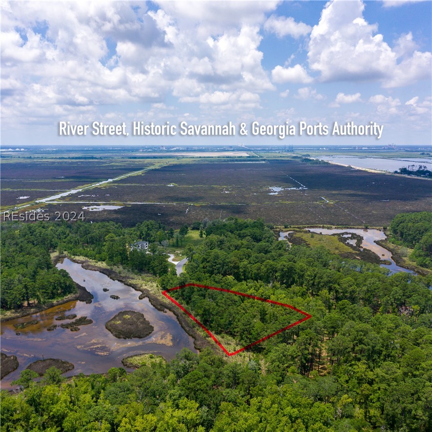 859 Bridle Path Boulevard Hardeeville, SC 29927 - Photo 18 of 40 Aerial view of Lot 27 and the magnificent water/marsh views that face east. This pond was once part of the historic rice fields (seen in the distance) of the south. Now it is a place to observe resident shore birds and stunning sunrises to the east.