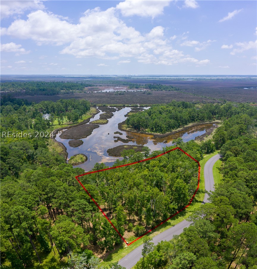 859 Bridle Path Boulevard Hardeeville, SC 29927 - Photo 20 of 40 Aerial view of Lot 27 and the magnificent water/marsh views that face east. This pond was once part of the historic rice fields (seen in the distance) of the south. Now it is a place to observe resident shore birds and stunning sunrises to the east.