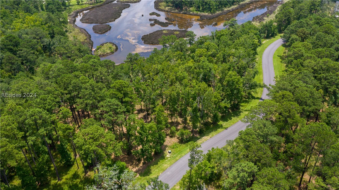 859 Bridle Path Boulevard Hardeeville, SC 29927 - Photo 23 of 40 Aerial view of Lot 27 and the magnificent water/marsh views beyond. This pond was once part of the historic rice fields of the south. Now it is a place to observe resident shore birds and stunning sunrises.