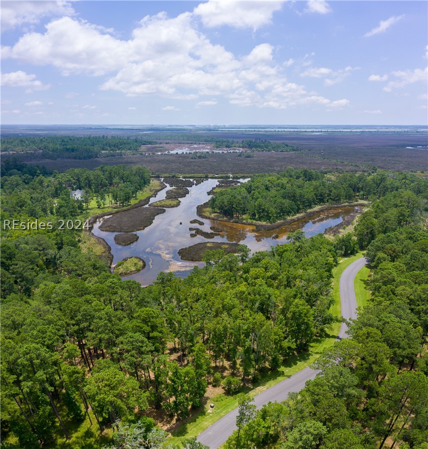 859 Bridle Path Boulevard Hardeeville, SC 29927 - Photo 24 of 40 Aerial view of Lot 27 and the magnificent water/marsh views beyond and Savannah in the distance. This pond was once part of the historic rice fields of the south. Now it is a place to observe resident shore birds and stunning sunrises to the east.