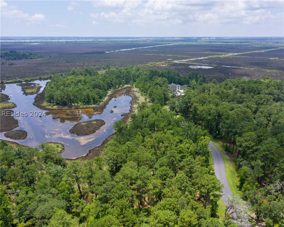 859 Bridle Path Boulevard Hardeeville, SC 29927 - Photo 26 of 40 Aerial view of Lot 27 and the magnificent water/marsh views beyond and Savannah in the distance. This pond was once part of the historic rice fields of the south. Now it is a place to observe resident shore birds and stunning sunrises to the east.