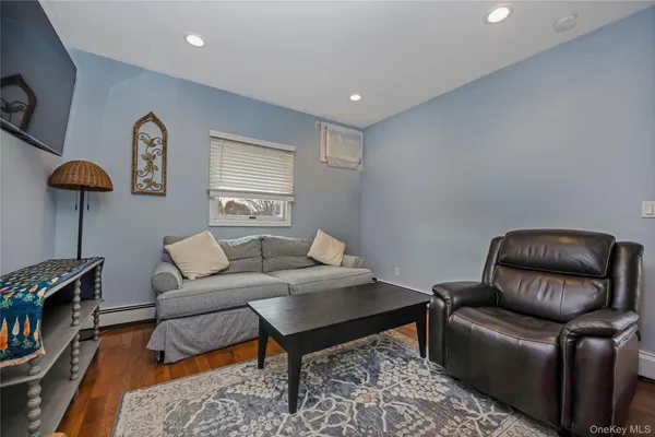 a living room with furniture and a rug
