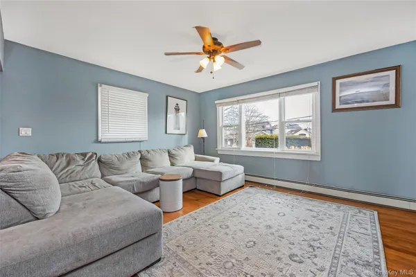 a living room with furniture and a window