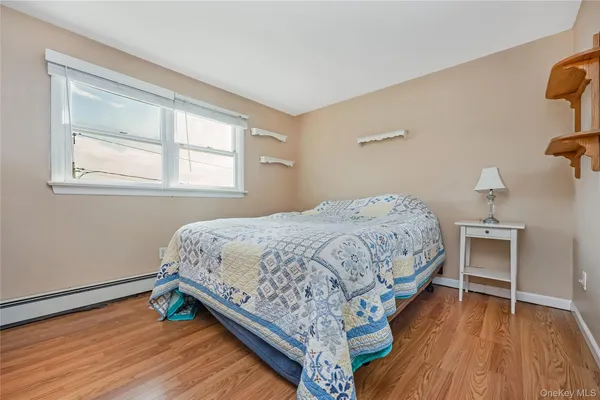 a bedroom with a bed and a desk