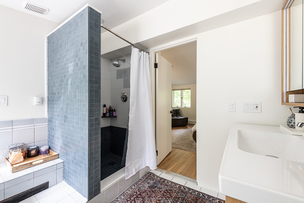 7 Diamond Road Lexington, MA 02420 - Photo 24 of 42 a bathroom with a tub and a shower