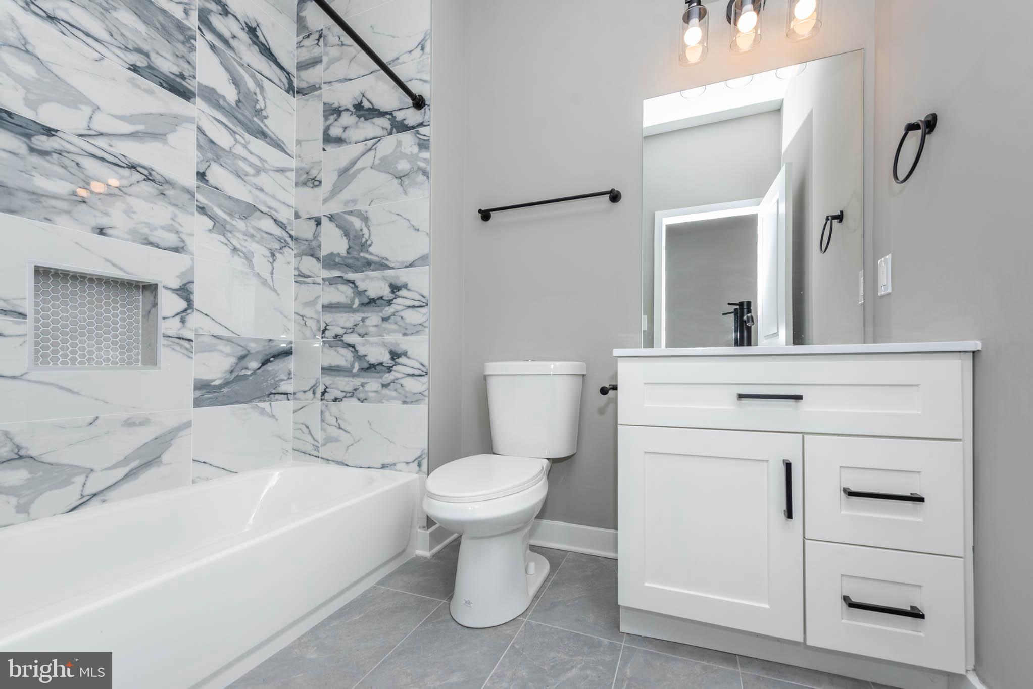 1330 Division Street Baltimore, MD 21217 - Photo 17 of 39 a bathroom with a sink toilet and shower