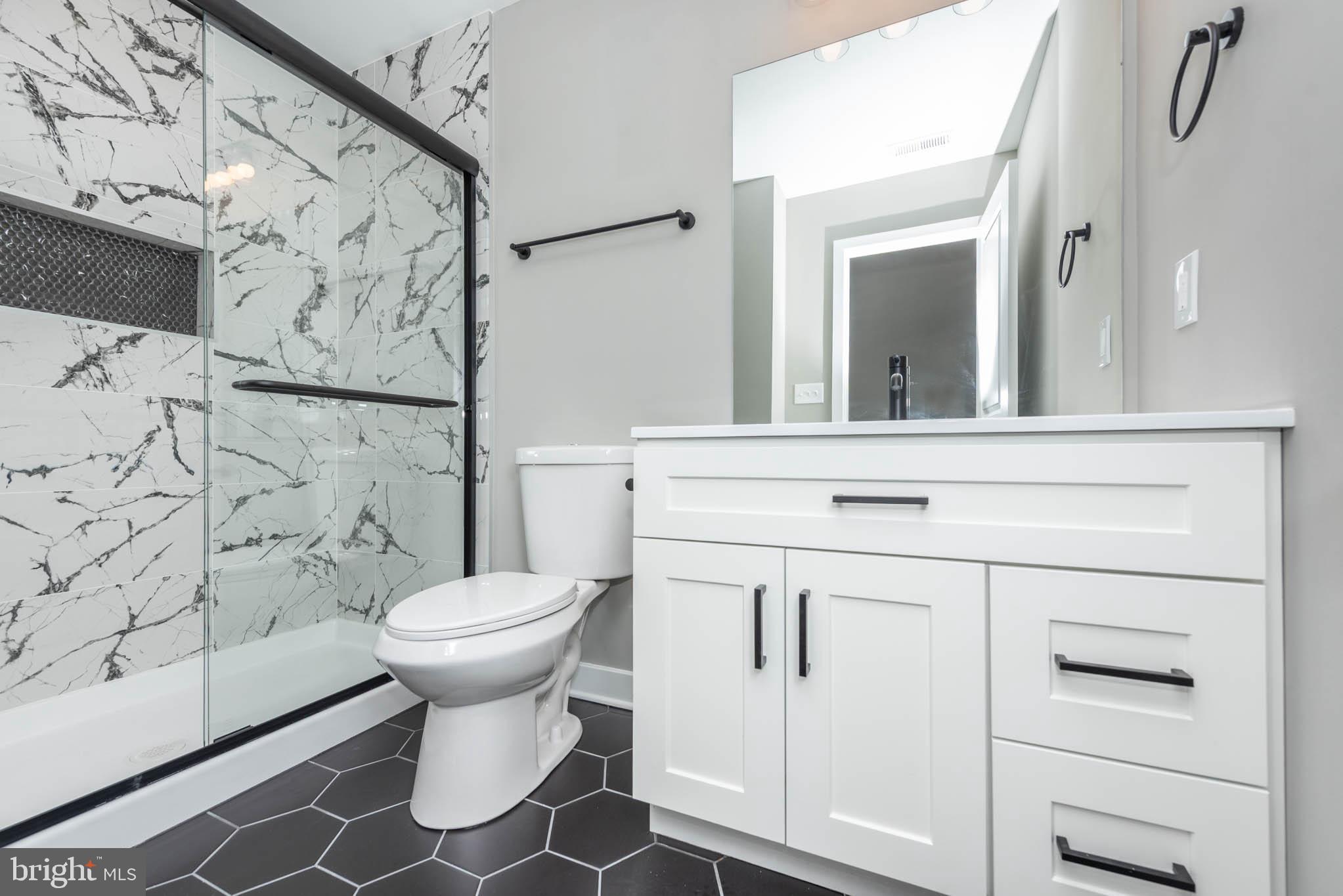 1330 Division Street Baltimore, MD 21217 - Photo 28 of 39 a bathroom with a sink toilet and shower