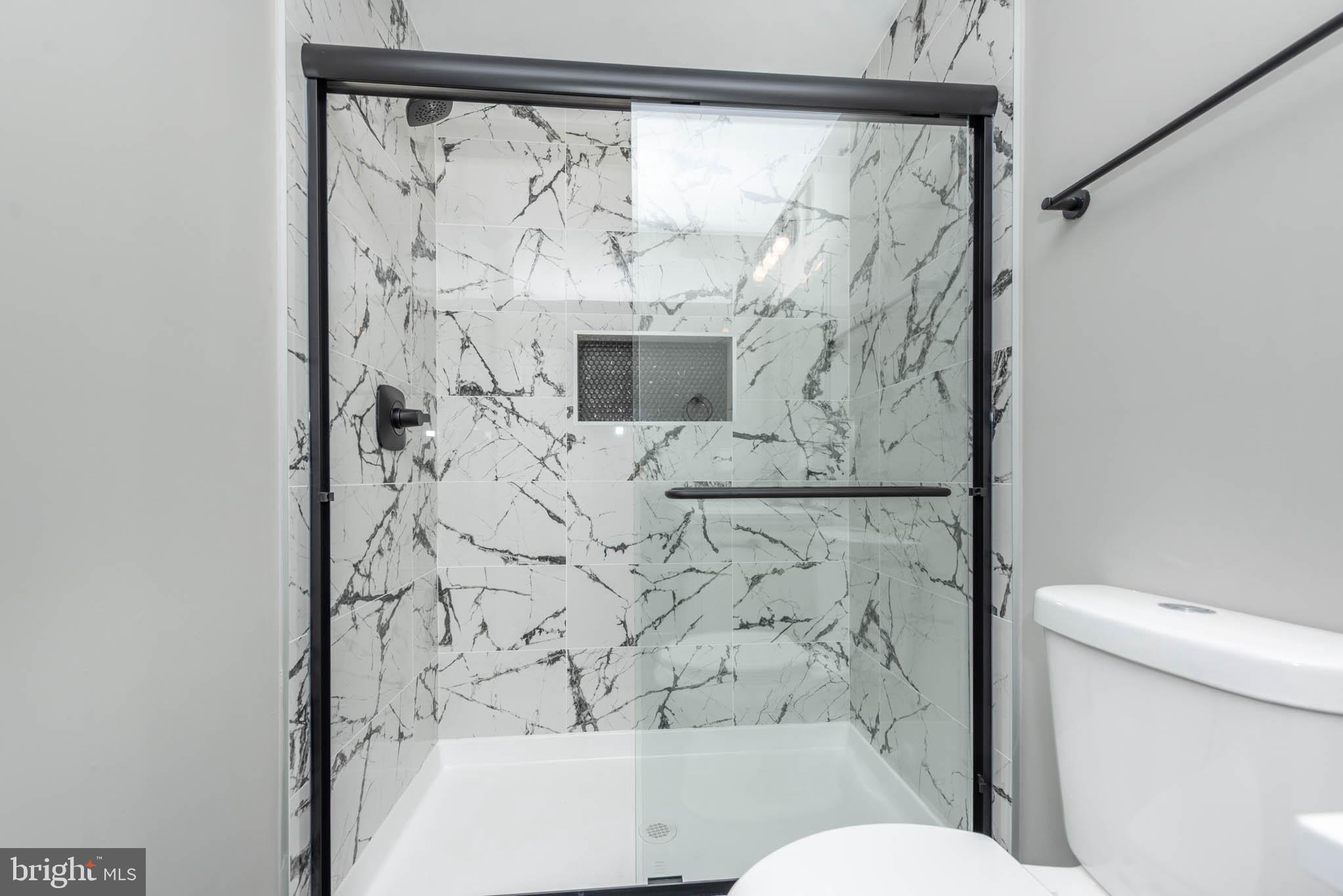 1330 Division Street Baltimore, MD 21217 - Photo 29 of 39 a bathroom with a toilet and shower