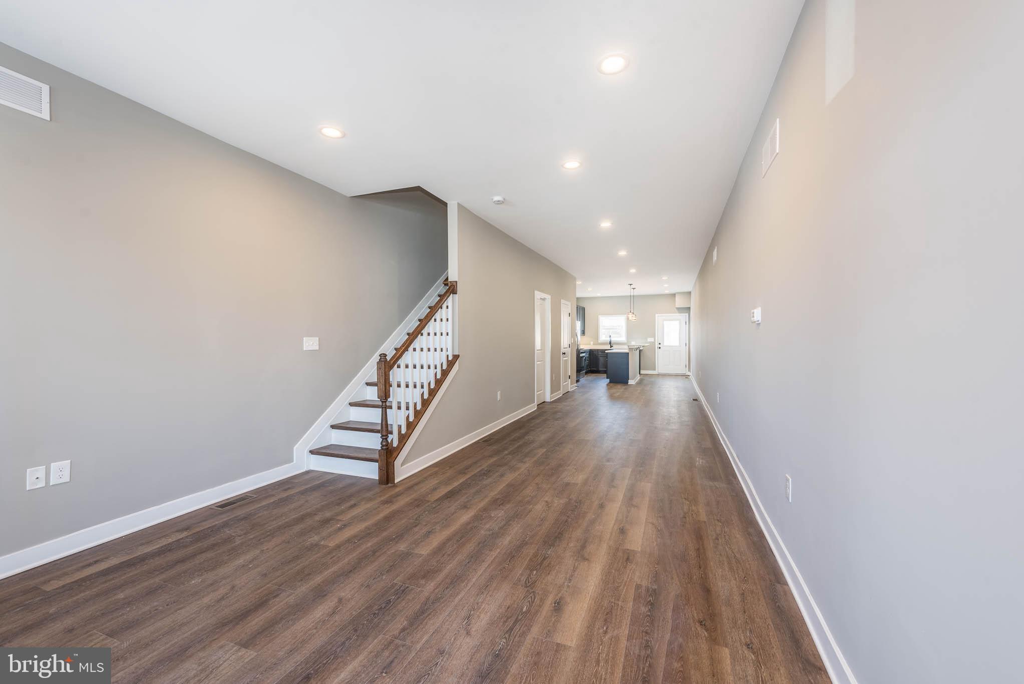1330 Division Street Baltimore, MD 21217 - Photo 3 of 39 a view of a hallway with wooden floor