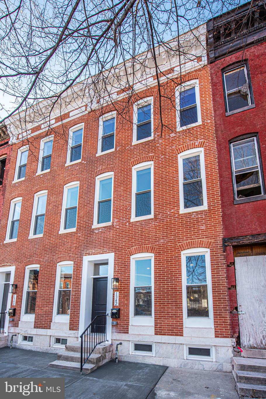 1330 Division Street Baltimore, MD 21217 - Photo 39 of 39 a front view of a building with glass windows