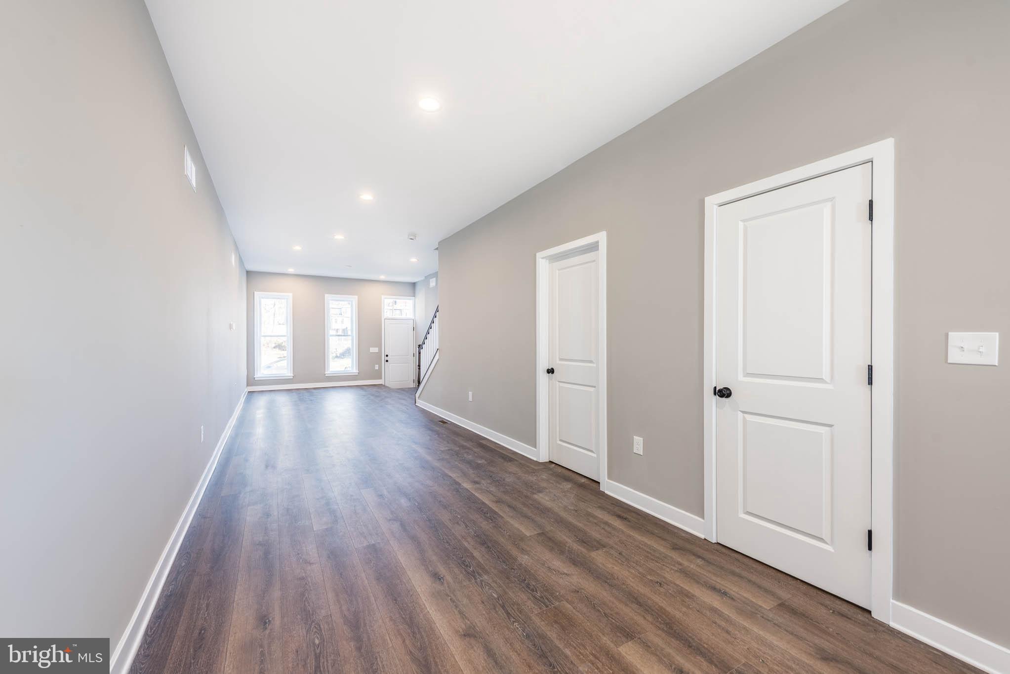 1330 Division Street Baltimore, MD 21217 - Photo 8 of 39 wooden floor in an empty room with a window