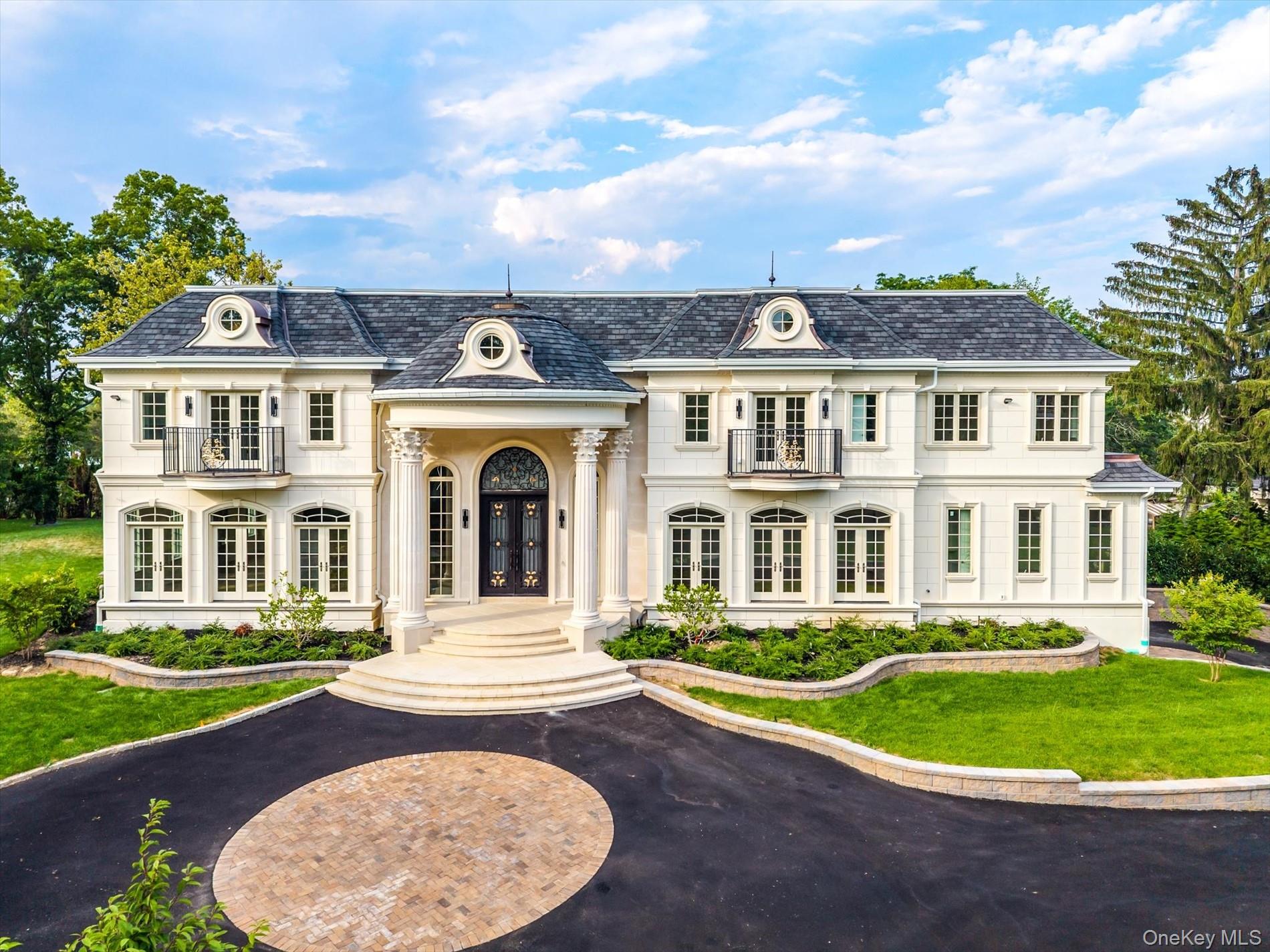 566 A East Shore Road Queens, NY 11024 - Photo 3 of 42 View of front of home featuring french doors, a front lawn, and a high end roof