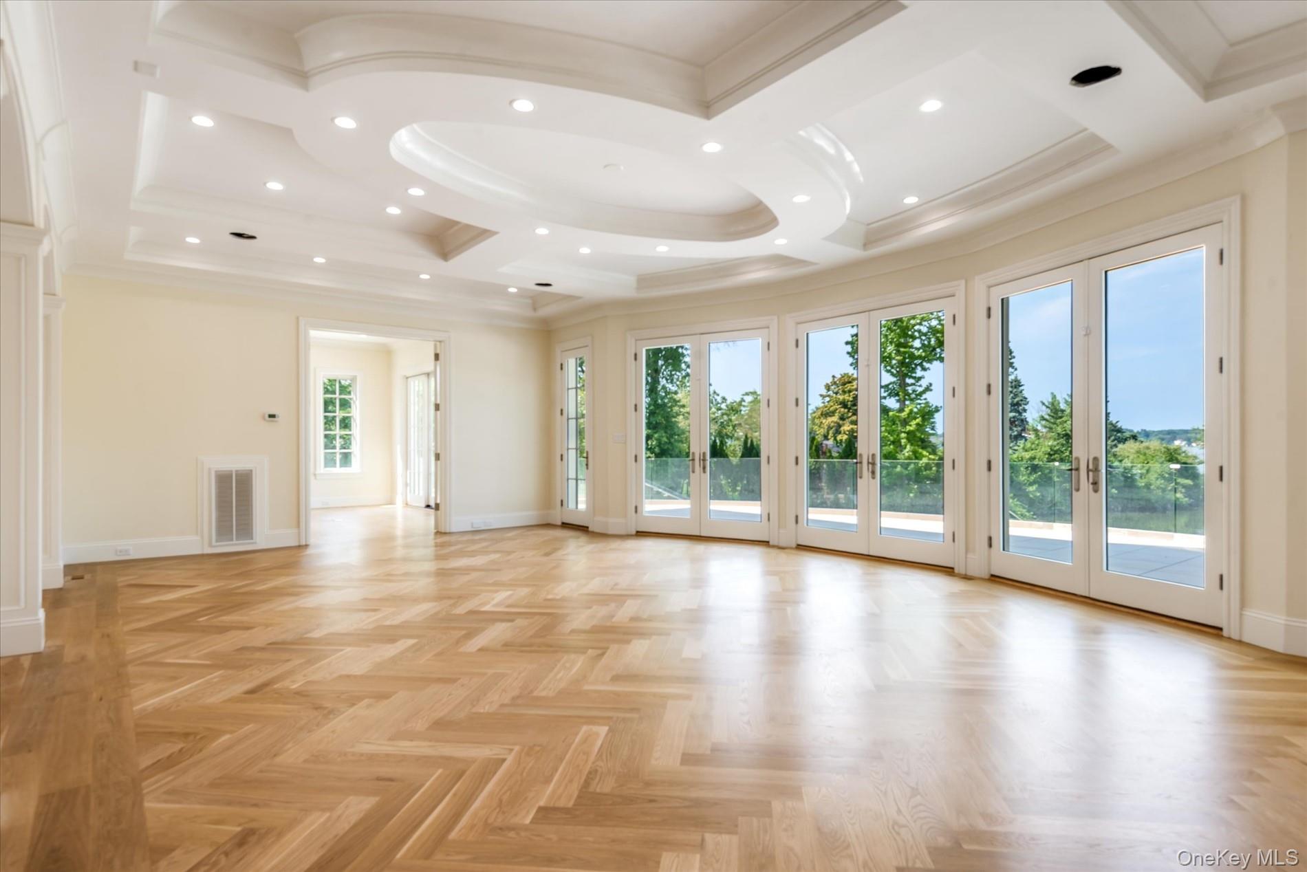 566 A East Shore Road Queens, NY 11024 - Photo 7 of 42 Unfurnished room featuring recessed lighting, coffered ceiling, french doors, ornamental molding, and beamed ceiling