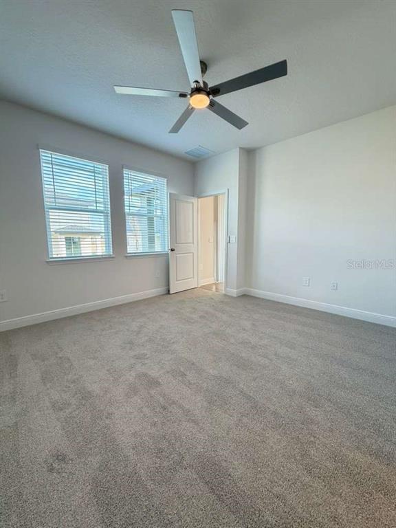 2265 Hen Road Minneola, FL 34715 - Photo 18 of 36 a view of an empty room with a window