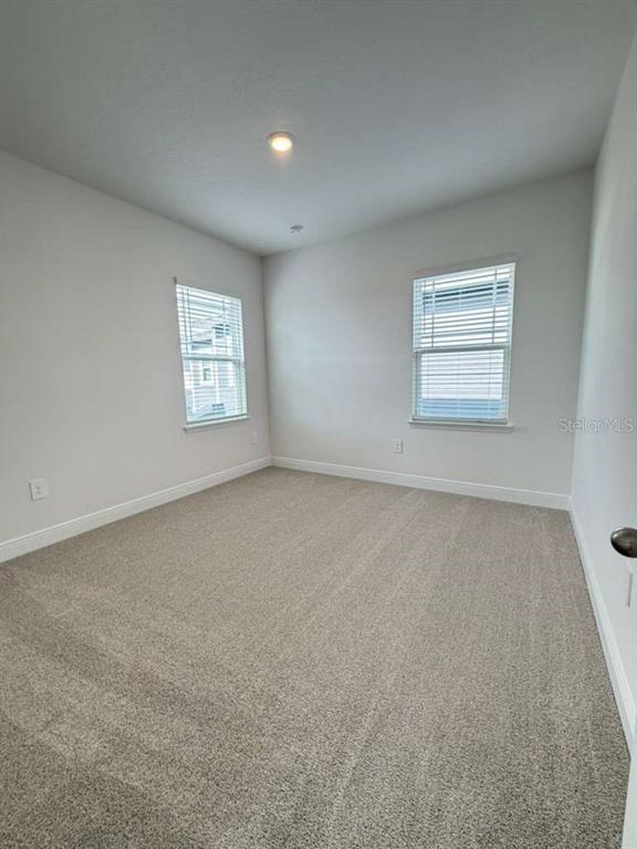 2265 Hen Road Minneola, FL 34715 - Photo 26 of 36 an empty room with a window