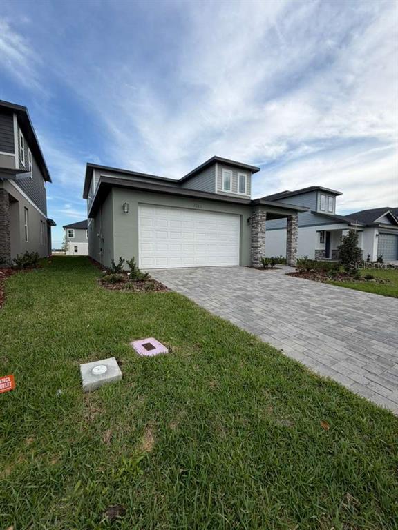 2265 Hen Road Minneola, FL 34715 - Photo 3 of 36 a backyard of a house with yard and barbeque oven