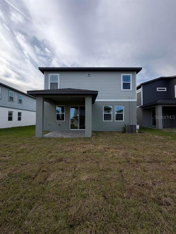 2265 Hen Road Minneola, FL 34715 - Photo 33 of 36 a front view of a house with a garden