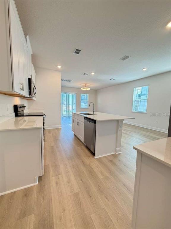 2265 Hen Road Minneola, FL 34715 - Photo 8 of 36 a view of kitchen with stainless steel appliances cabinets