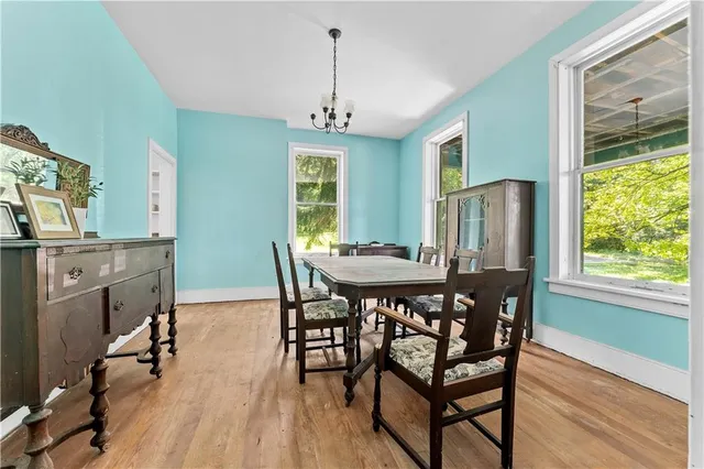 a dining room with furniture window wooden floor