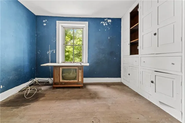 a bedroom with window