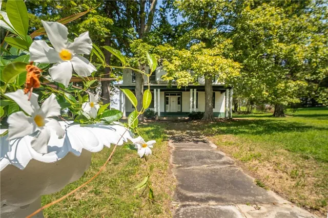 a front view of a house with a yard