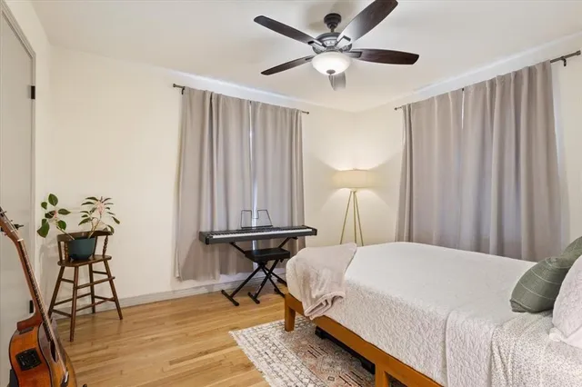 a bedroom with a bed and a table